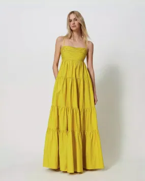 Abito lungo giallo in cotone con gonna a balze e corpetto drappeggiato
