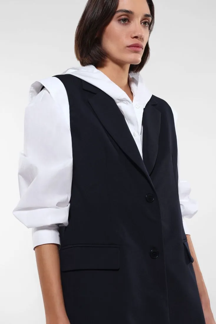 Gilet lungo con tasche a filetto e pattina