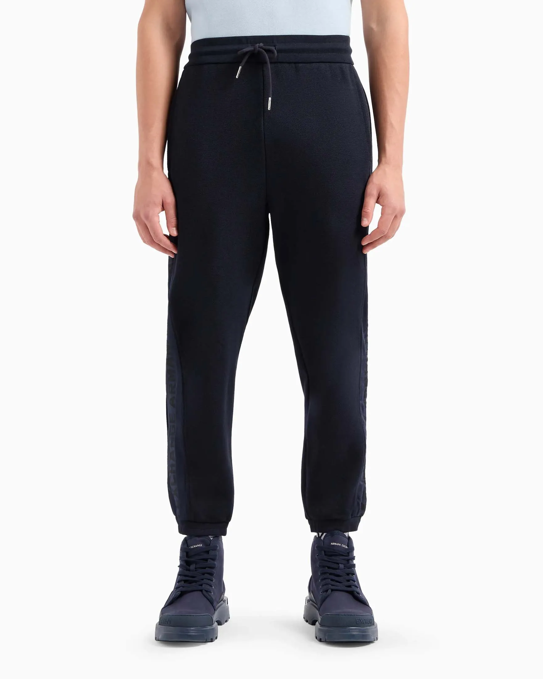 Joggers blu in piqué di cotone con logo parlato jacquard in tono sulle bande laterali